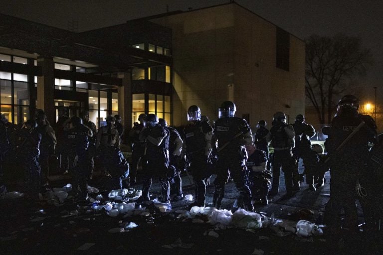 Authorities respond to a scene in front of the Brooklyn Center Police station