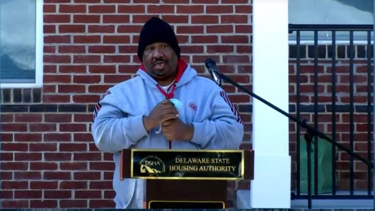 Andre Frantone speaks from a podium