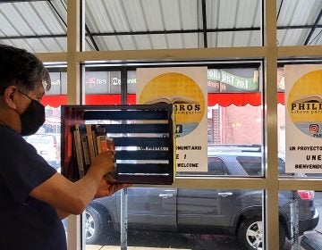 Edgar Ramírez fills up the wooden library with books