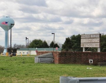 A view of a sign for a correctional facility.