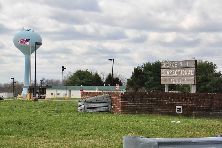 A view of a sign for a correctional facility.