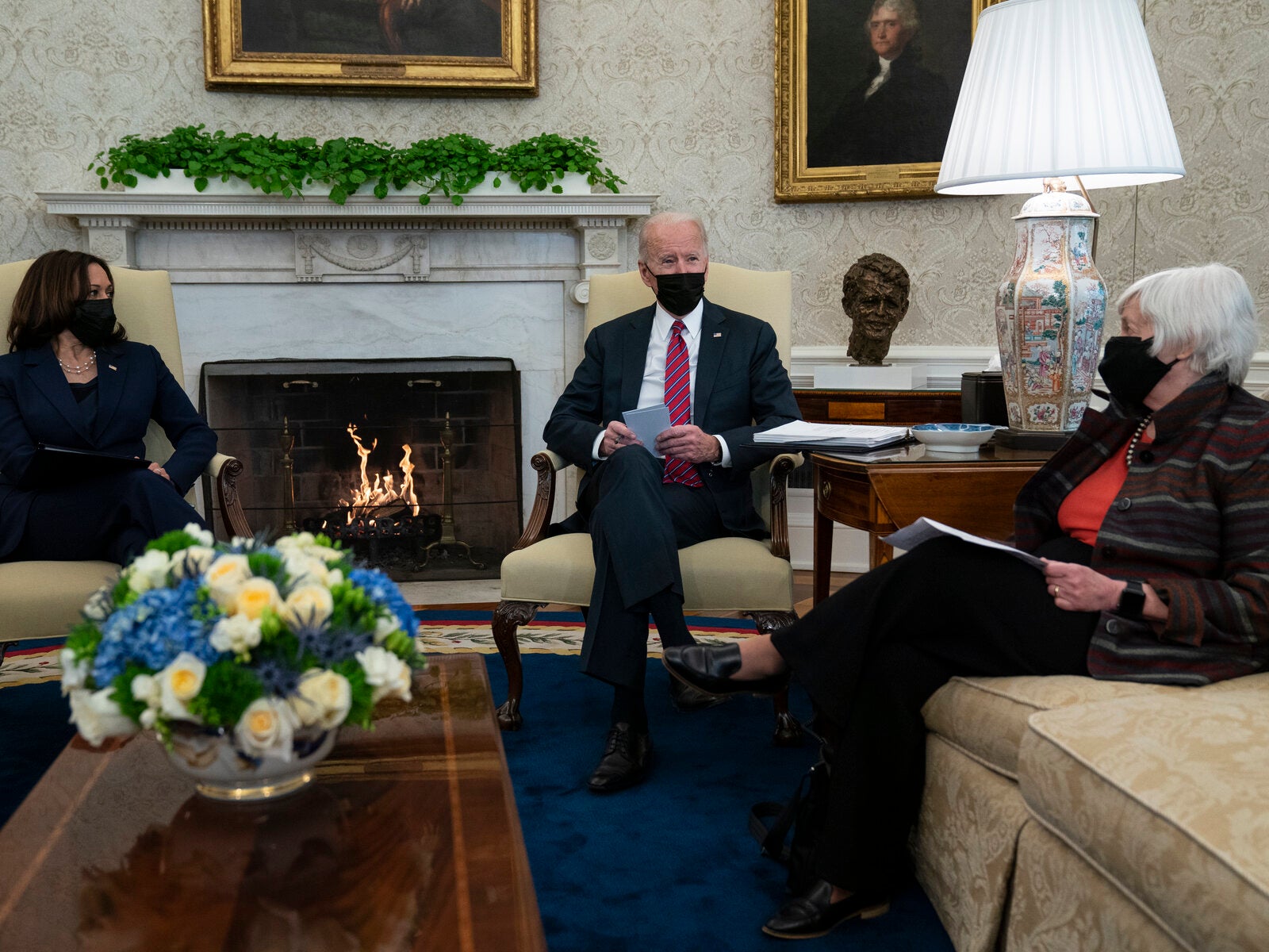 President Joe Biden meets with Treasury Secretary Janet Yellen, right, and Vice President Kamala Harris in the Oval Office