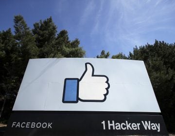 the thumbs up Like logo is shown on a sign at Facebook headquarters in Menlo Park, Calif.