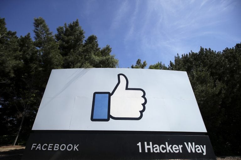 the thumbs up Like logo is shown on a sign at Facebook headquarters in Menlo Park, Calif.