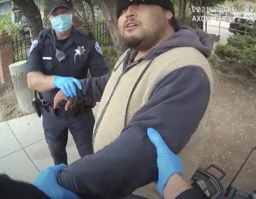 A screenshot of the Alameda Police Department body camera footage shows officers detaining Mario Gonzalez