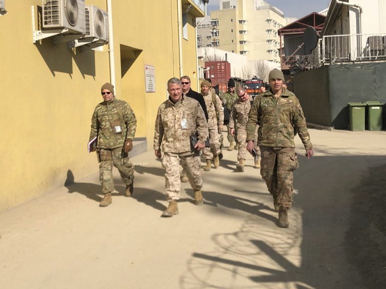 Marine Gen. Frank McKenzie, (center) is shown visiting Kabul, Afghanistan in January 2020. The Biden administration said it plans to complete a draw down of U.S. troops in the country by Sept. 11. Lolita Baldor/AP