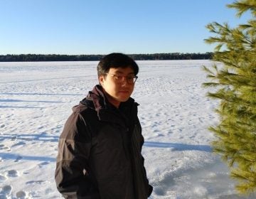 Bao Ha stands outside in the snow