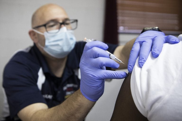 A patient at the Vaccination clinic in McKeesport at the Bethlehem Baptist Church receives the COVID-19 vaccine