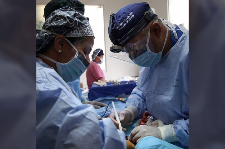 Dr. Shubha Varma and her husband perform a surgery together on a medical mission in the Dominican Republic. (Courtesy of Dr. Shubha Varma)