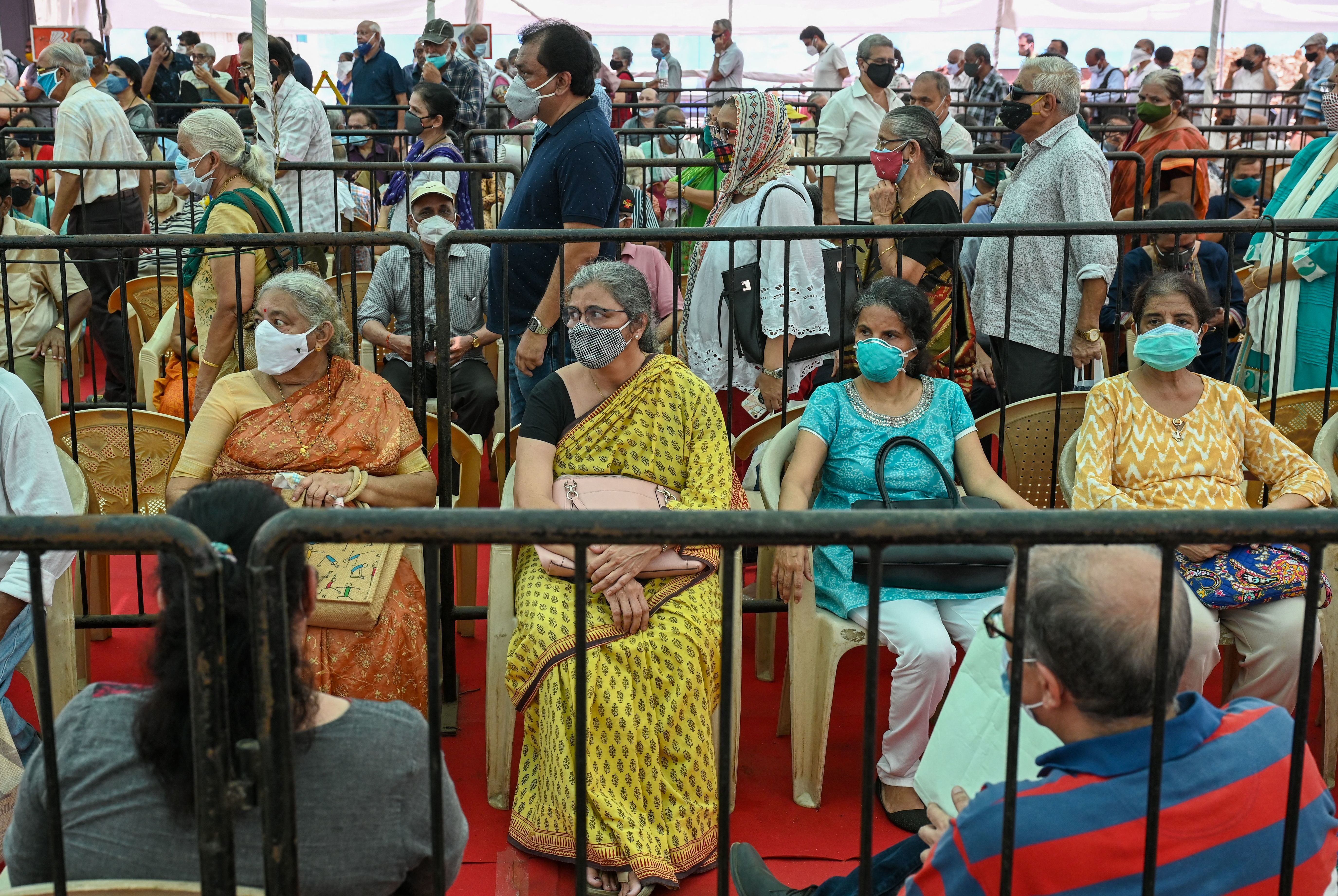 People line up to receive a COVID-19 vaccine