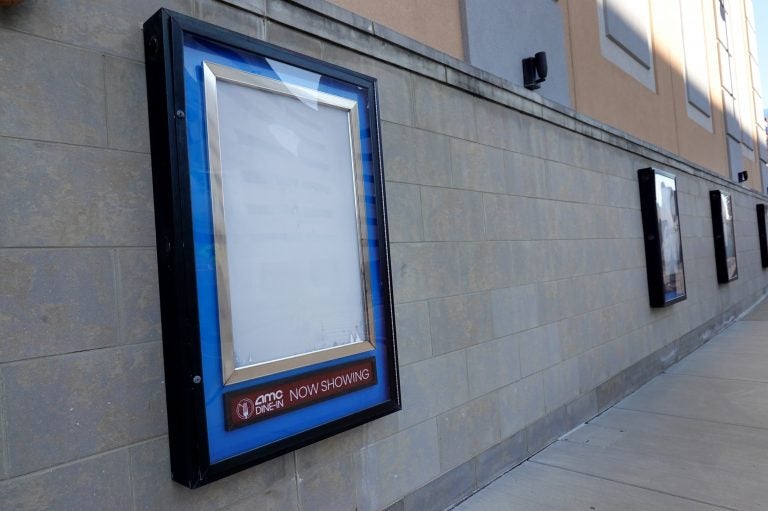 Empty frames that would normally hold movie posters hang on the front of an AMC theater shuttered by the coronavirus pandemic on Dec. 4, 2020, in Rosemont, Ill. (Scott Olson/Getty Images)