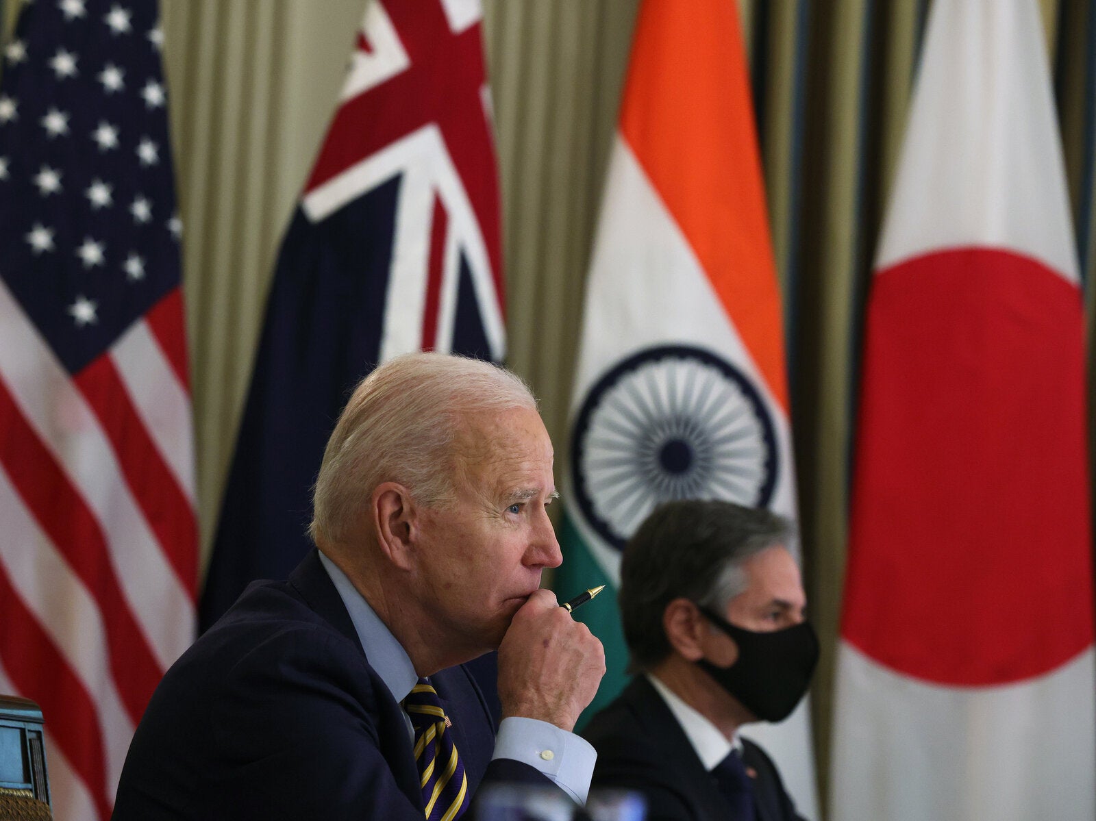 President Biden and Secretary of State Antony Blinken participate in a virtual meeting