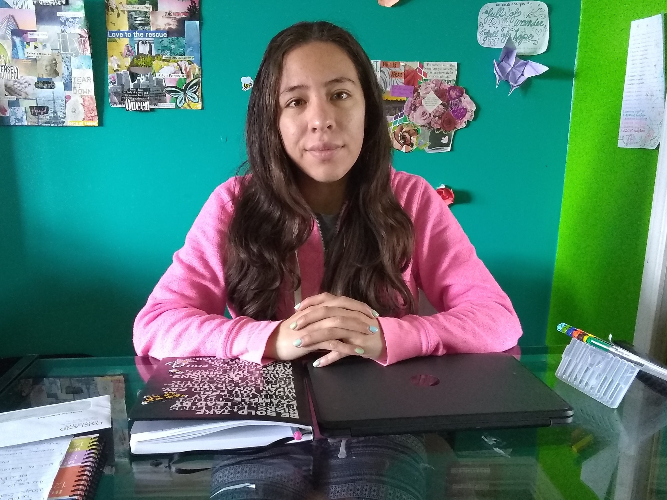 Guadalupe Avalos sits a table inside