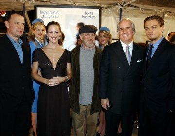 Frank W. Abagnale Jr. (second from the right) is famous for his audacious cons, documented in the blockbuster movie “Catch Me If You Can.” But science writer Alan Logan says the real grift is Abagnale’s entire life story. (Rene Macura/AP Photo)