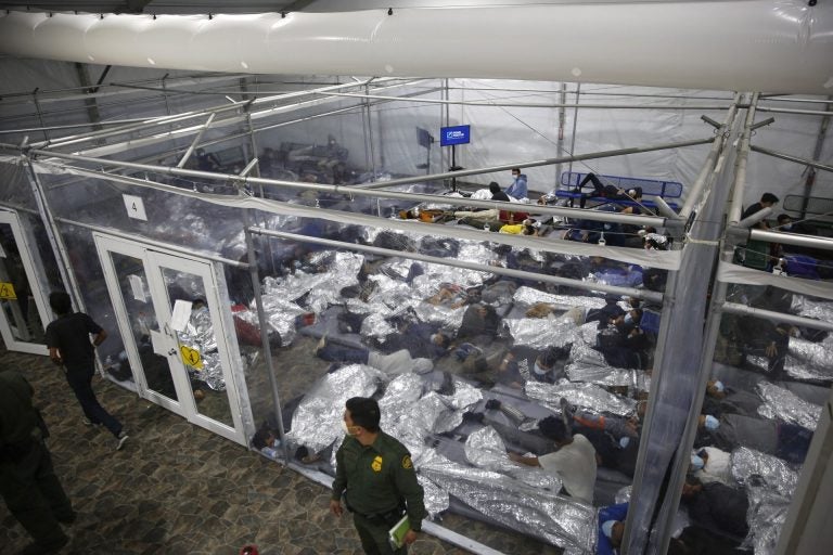 In this March 30, 2021, file photo, young minors lie inside a pod at the Donna Department of Homeland Security holding facility, the main detention center for unaccompanied children in the Rio Grande Valley run by U.S. Customs and Border Protection (CBP), in Donna, Texas. (Dario Lopez-Mills/AP Photo)