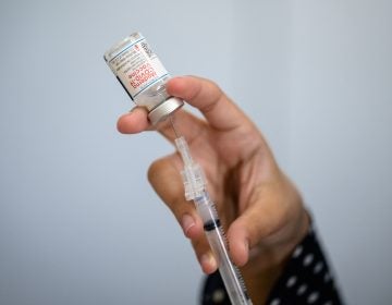 To understand vaccine-induced immunity more fully, researchers are comparing antibody levels in people who received the Moderna vaccine but still got COVID-19 with levels in people who got the vaccine but didn't fall ill. (Angela Weiss/AFP via Getty Images)
