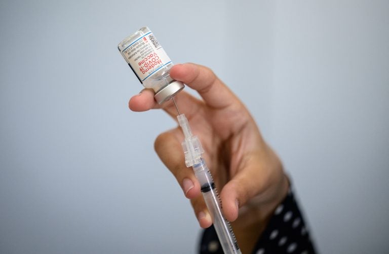 To understand vaccine-induced immunity more fully, researchers are comparing antibody levels in people who received the Moderna vaccine but still got COVID-19 with levels in people who got the vaccine but didn't fall ill. (Angela Weiss/AFP via Getty Images)