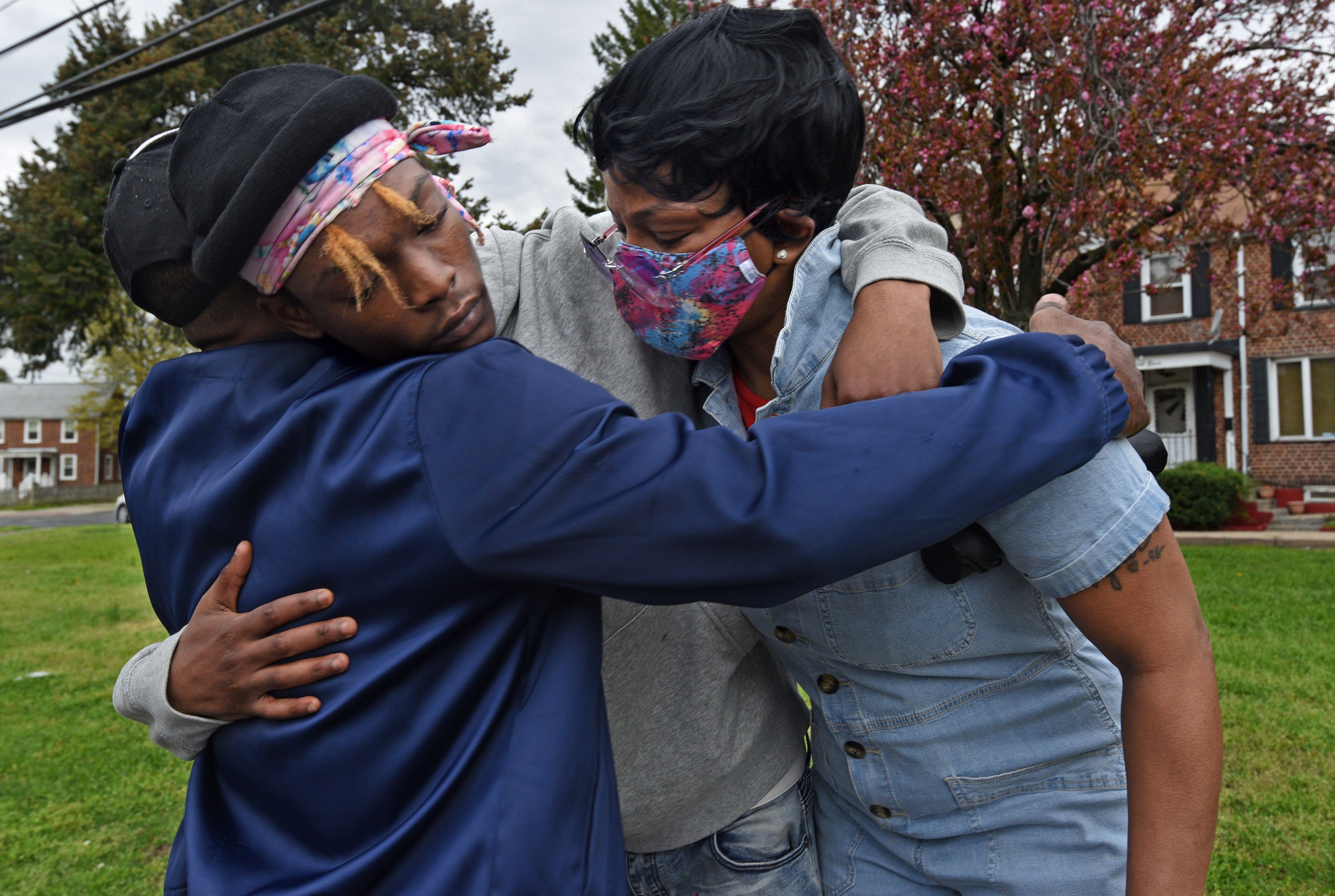 Deshine Barnes and Sharrell Barnes receive a hug