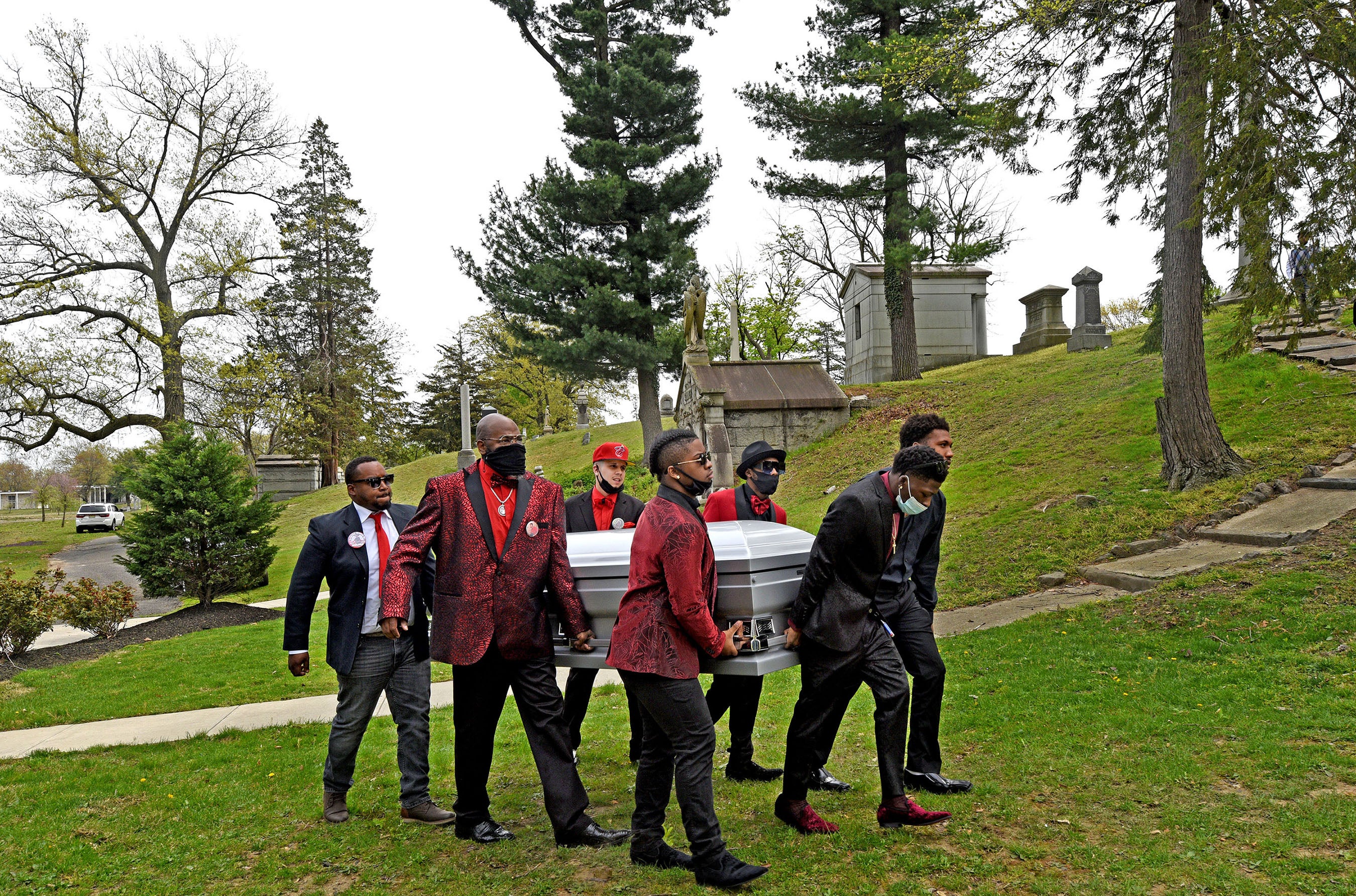 Pallbearers carry the casket of Nah'Jole Frazier