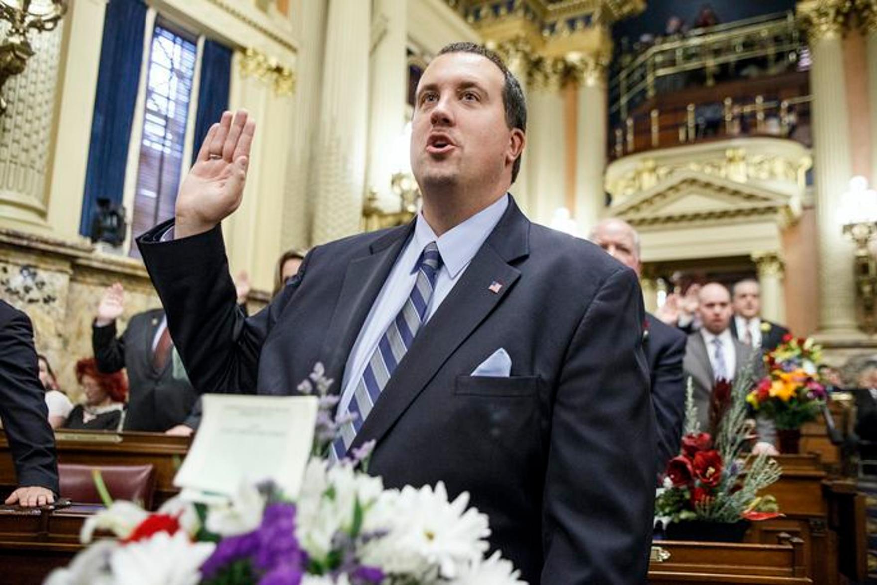 Rep. Seth Grove holds up his right hand