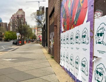 Oat milk ads cover street art on South Broad Street.