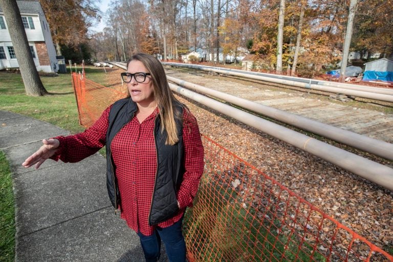 Rebecca Britton stands outside near pipeline construction