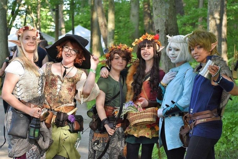 A group of people dressed up in costumes at the New Jersey Renaissance Faire