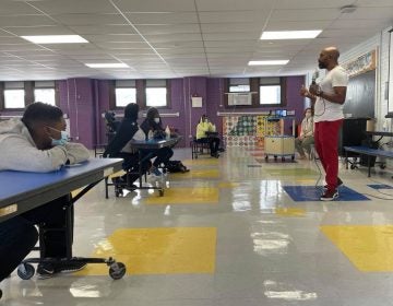 Kamau Stanford, chief operating officer for the Philadelphia Black Doctors COVID-19 Consortium, speaks to students at Mastery Charter School’s Shoemaker campus Friday. (Johann Calhoun/Chalkbeat)