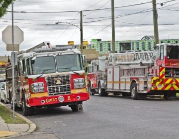 Fire trucks parked on Magee Street