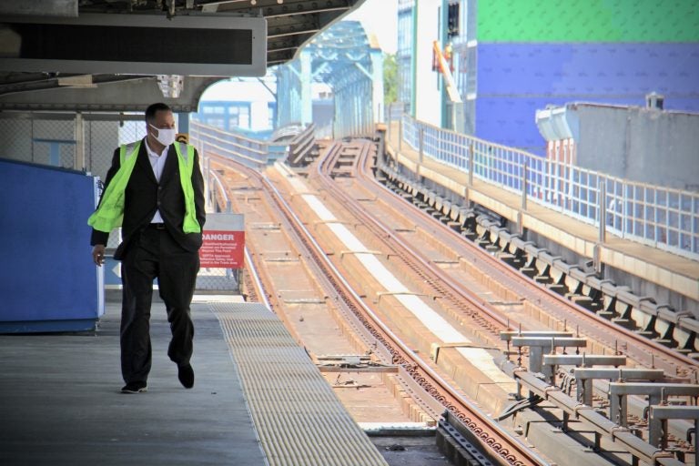 Assistant Director of Transportation Ken Divers, who leads the vulnerable population task force at SEPTA, walks on the platform at Somerset Station. (Emma Lee/WHYY)