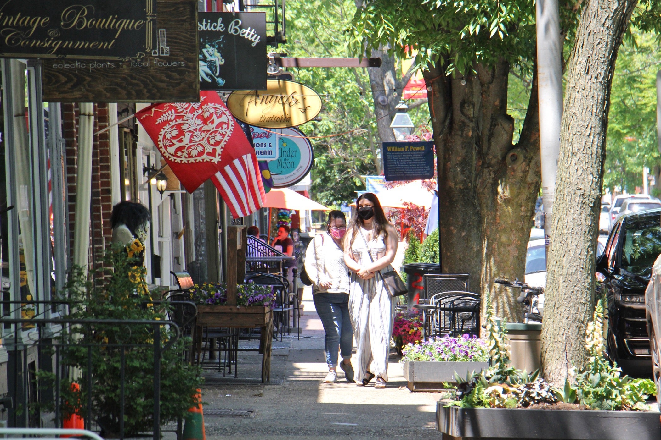 Shoppers walk on Farnsworth Avenue