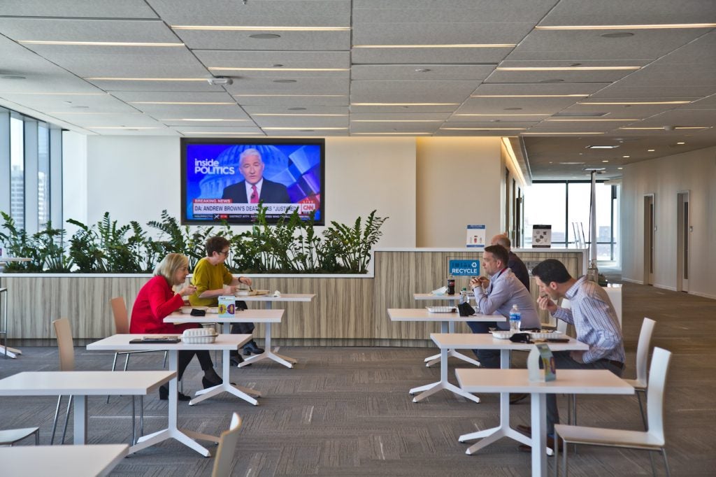 FMC employees sit at individual tables