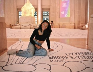 Dyymond Whipper-Young, an art teacher at Independence Charter School created a world-record-breaking drawing for the Franklin Institute's Creativitiy Exhibition. (Emma Lee/WHYY)