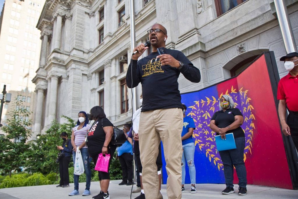 Joel Wilson, president of the Philadelphia chapter of 100 Black Men, speaks at a vigil for George Floyd outside City Hall in Philadelphia on May 25, 2021. (Kimberly Paynter/WHYY)