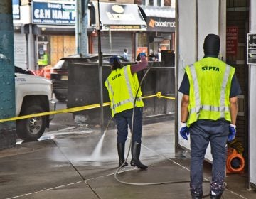 SEPTA workers power wash Allegheny Station on Kensington Avenue. (Kimberly Paynter/WHYY)