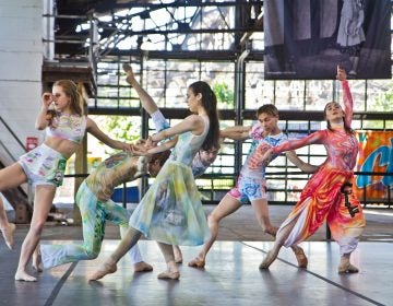 Young girls dancing in colorful costumes at the Cherry Street Pier