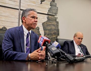 Carlos Vega, candidate for Philadelphia district attorney, speaks after getting the endorsement of former Pennsylvania Gov. Ed Rendell (right). (Emma Lee/WHYY)