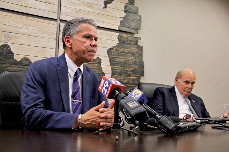 Carlos Vega, candidate for Philadelphia district attorney, speaks after getting the endorsement of former Pennsylvania Gov. Ed Rendell (right). (Emma Lee/WHYY)