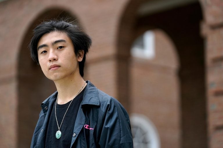 Nicholas Sugiarto, of San Diego, Calif., a student at Dartmouth College, stands for a photograph on the school's campus, Tuesday, April 20, 2021, in Hanover, N.H. (AP Photo/Steven Senne)