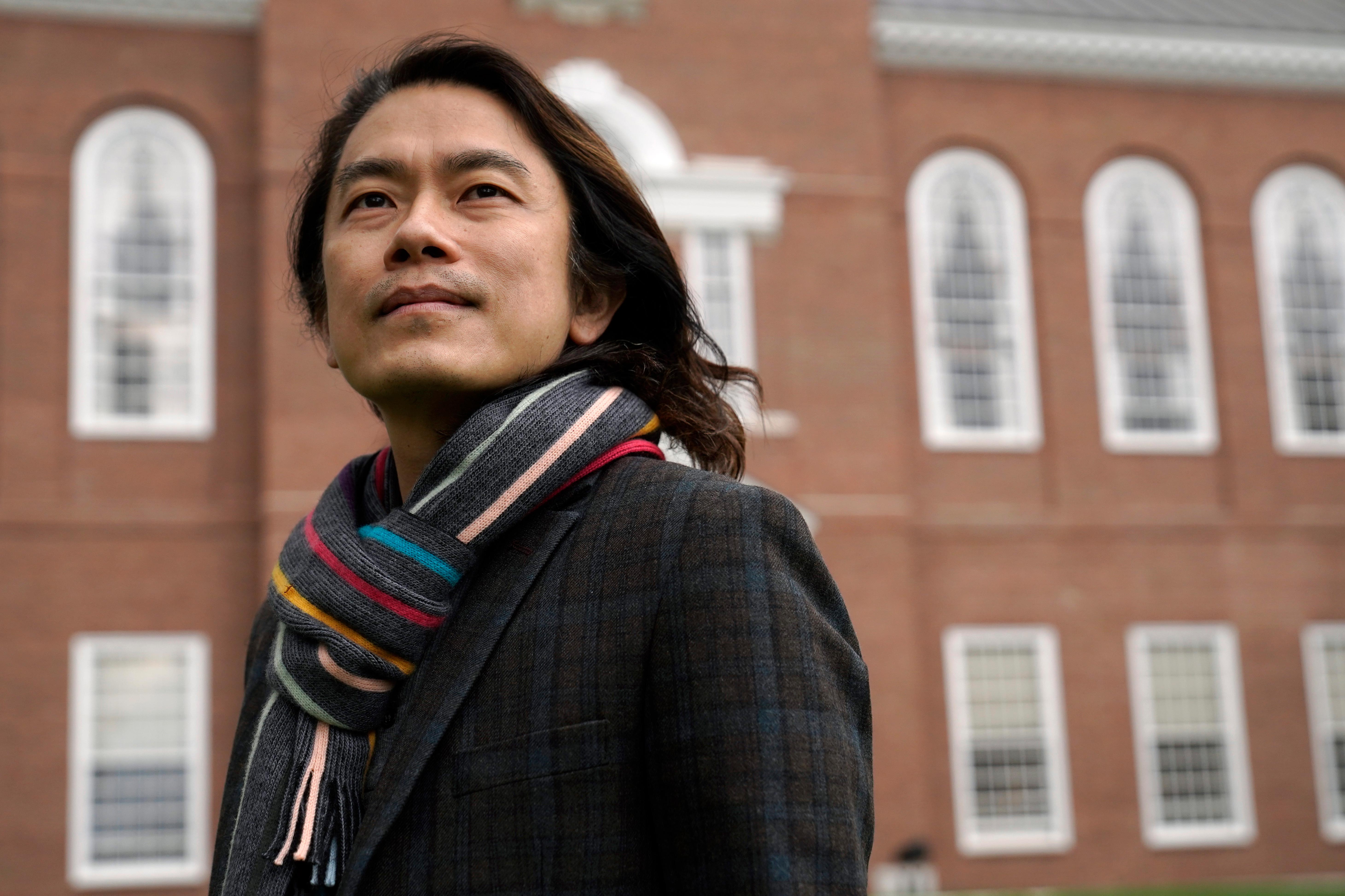 Eng-Beng Lim, a professor at Dartmouth College, stands for a photograph on the school's campus, Tuesday, April 20, 2021, in Hanover, N.H. (AP Photo/Steven Senne)