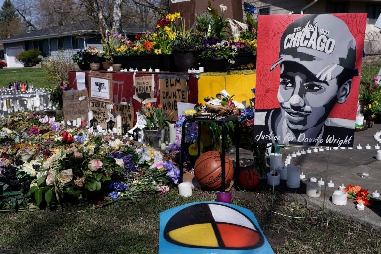 A makeshift memorial is seen Thursday, April 22, 2021, in Brooklyn Center, Minn., near the site of the fatal shooting of Daunte Wright by a police officer during a traffic stop. (AP Photo/Morry Gash)