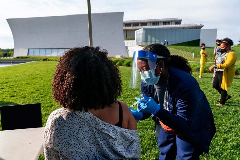 In this May 6, 2021, file photo, Kendria Brown, a nurse with DC health, vaccinates a woman with the Johnson & Johnson COVID-19 vaccine at The REACH at the Kennedy Center in Washington. (AP Photo/Jacquelyn Martin, File)