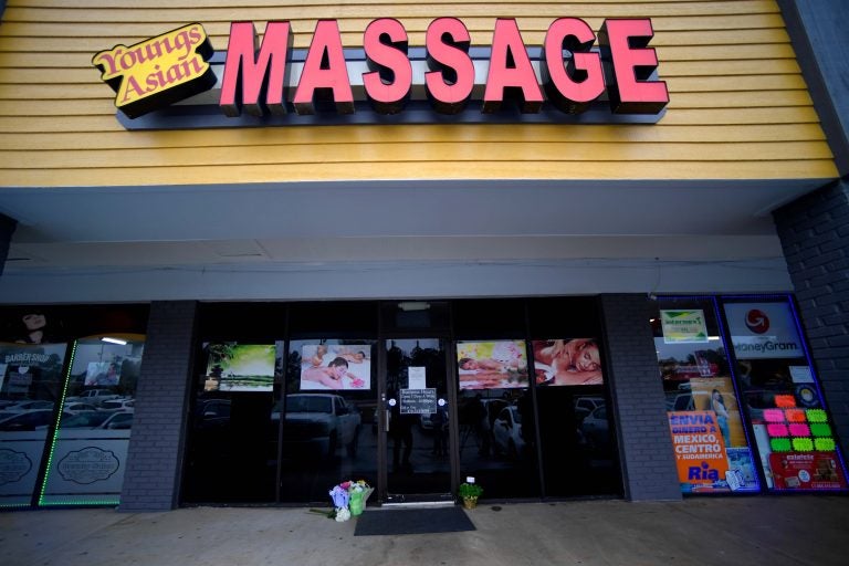 In this Wednesday, March 17, 2021 file photo, A make-shift memorial is seen outside a business where a multiple fatal shooting occurred on Tuesday, in Acworth, Ga. (AP Photo/Mike Stewart)