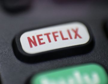 FILE - This Aug. 13, 2020 file photo shows a logo for Netflix on a remote control in Portland, Ore. Streaming services ranging from Netflix to Disney+ want us to stop sharing passwords. That's the new edict from the giants of streaming media, who hope to discourage the common practice of sharing account passwords without alienating their subscribers, who've grown accustomed to the hack. (AP Photo/Jenny Kane, File)