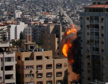 An Israeli airstrike hits the high-rise building housing The Associated Press’ offices in Gaza City, Saturday, May 15, 2021. The airstrike Saturday came roughly an hour after the Israeli military ordered people to evacuate the building. There was no immediate explanation for why the building was targeted. The building housed The Associated Press, Al-Jazeera and a number of offices and apartment. (AP Photo/Hatem Moussa)