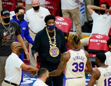 Philadelphia 76ers' Ben Simmons, from left, and Joel Embiid greet Dwight Howard and Shake Milton during a timeout in the first half of an NBA basketball game against the Orlando Magic, Sunday, May 16, 2021, in Philadelphia. (AP Photo/Matt Slocum)