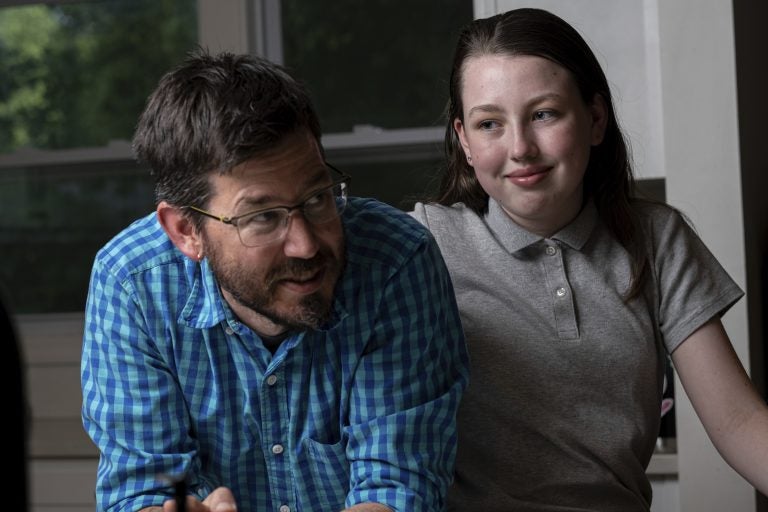 Jay Wamsted, left, and his daughter, Kira, are photographed on Thursday, May 20, 2021 in Smyrna, Ga. Wamsted, who is an 8th grade math teacher, allowed his daughter to skip testing this year. (AP Photo/Ben Gray)