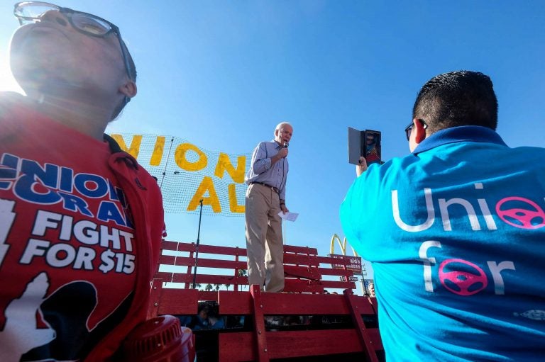 In this Dec. 19, 2019, file photo Democratic presidential candidate former Vice President Joe Biden, speaks at a rally in support of McDonald's cooks and cashiers who are demanding higher wages and union rights, outside a McDonald's restaurant in Los Angeles. (AP Photo/Ringo H.W. Chiu)