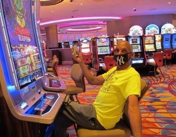 Gary Royster of Atlantic City holds up a wad of cash he used to gamble at the Hard Rock casino in Atlantic City