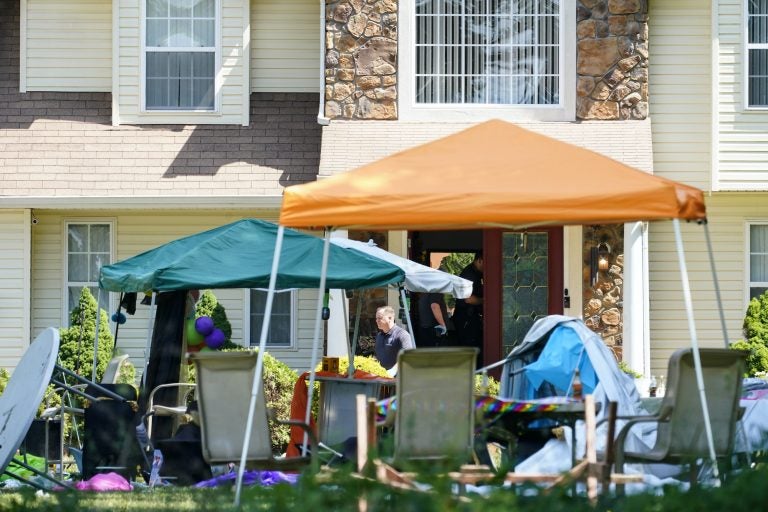 Party tents and decorations are askew in front of a Fairfield Twp. home